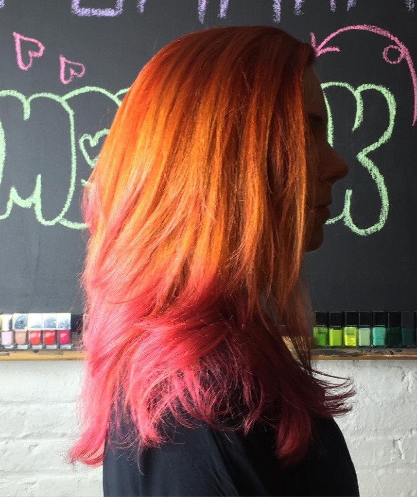 Kristin does a single process root with Redken's double copper and touches up the ombre with a custom mixed pink. This is a great way to have colorful hair without always having to bleach!